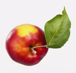 Ripe red apple with a leaf. Isolated on a white background