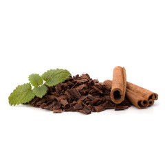 Crushed chocolate shavings pile and cinnamon sticks