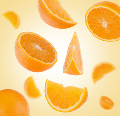 flying sliced orange fruit segments