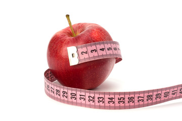 Apple with tape measure. Healthy lifestyle concept.