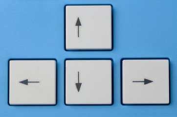 Keyboard arrow cursor buttons isolated on blue background.