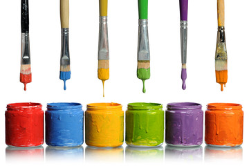 Paintbrushes Dripping into Paint Containers