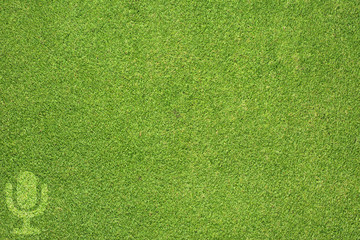 Microphone icon on green grass texture and  background