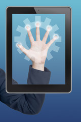 Hand pushing gear icon tablet on a touch screen blank interface