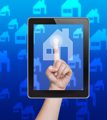 Hand pushing home button of tablet on a touch screen