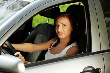 Women driving the car.