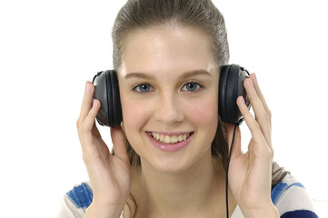 Close up women listening music in headphones