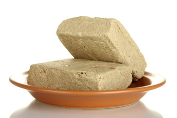 tasty halva in the plate isolated on white close-up