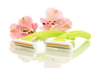 woman safety shavers and flowers isolated on white.