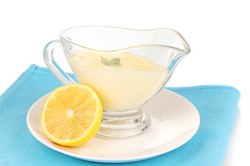 Mayonnaise in bowl on napkin isolated on white