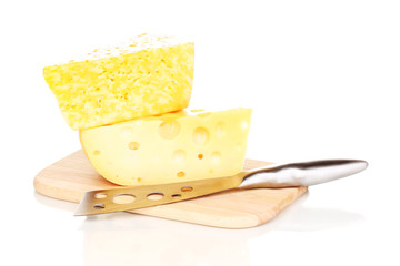 tasty cheese and knife on wooden board isolated on white