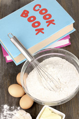 Eggs, flour and butter close-up on wooden table