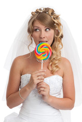 Smiled beauty bride with candy