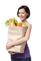 Good-looking girl with the packet of fruit and vegetables