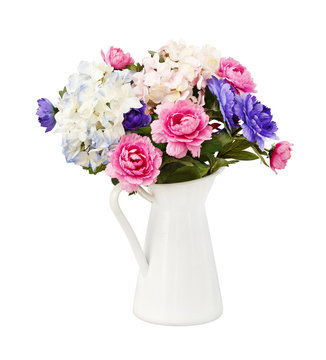 Colorful bouquet pink and blue flowers in white decorative bucke