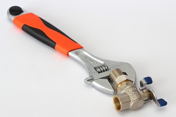 wrench and radiator crane over white