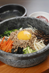 Korean rice with vegetable pork egg in hot bowl