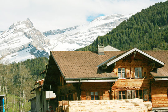 Lovely Swiss chalet with mountains in background