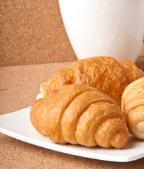 Breakfast with coffee and croissants 