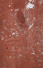 Wood with chipped red paint. Grunge style background