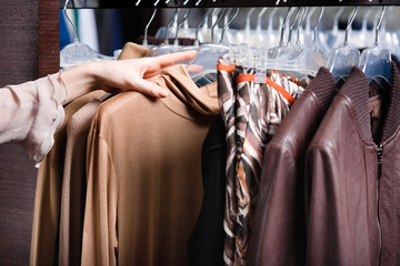 Choosing a piece of clothing, close up