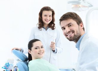 Dentist, his assistant and the patient