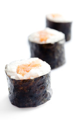 Row of three sushi rolls, isolated