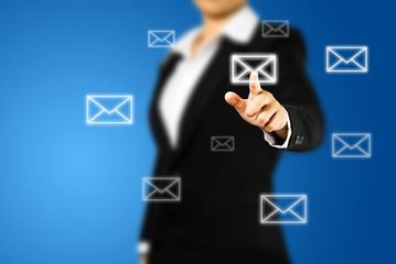 Business woman pressing virtual messaging type of icons