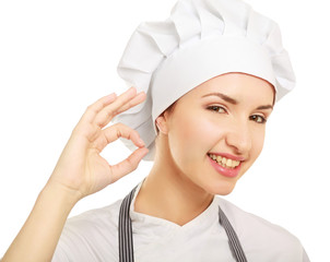 Attractive cook woman showing ok over white background