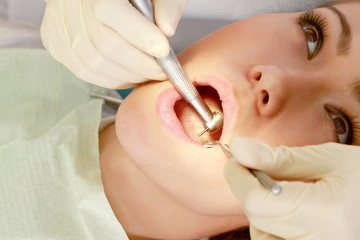 Obraz na płótnie Canvas Young woman with dentist in a dental surgery. 