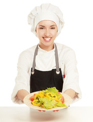 Pretty cook chief holding salad