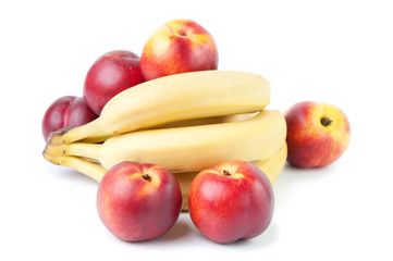Ripe nectarines and bananas, isolated over white