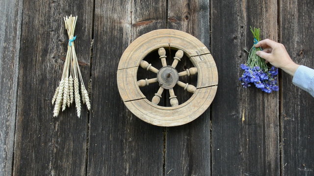 hanging wheat and cornflower bunch on old ranch wall