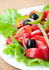 Fresh vegetable salad with olives 