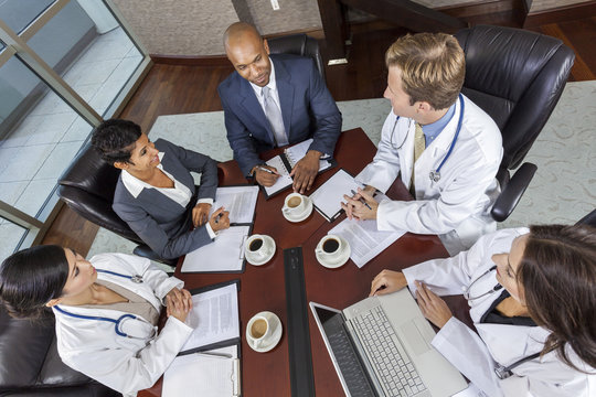 Interracial Medical Business Team Meeting in Boardroom