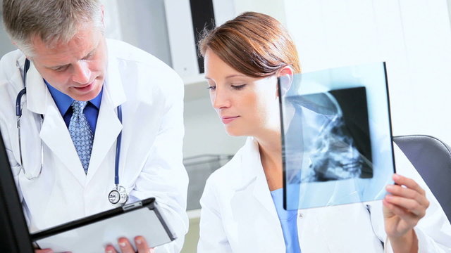 Hospital Doctors Using X-Ray with Wireless Tablet