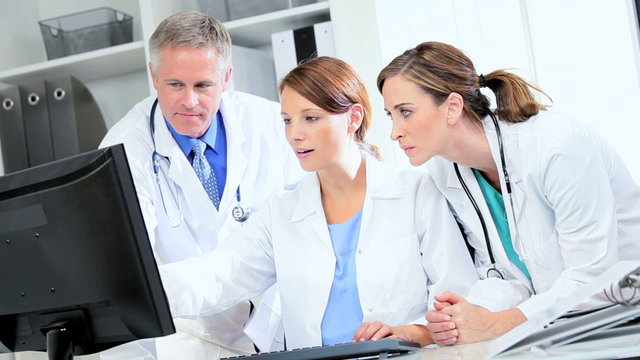 Caucasian Doctors Checking Medical Information