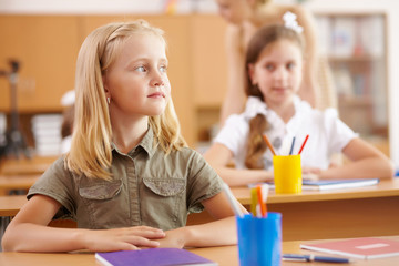 Little girl at school class