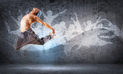 Obraz premium young man dancing hip hop with color lines