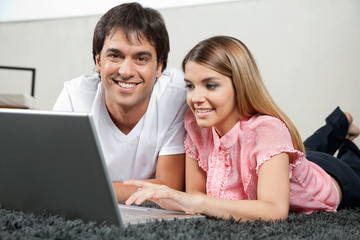Couple Using Laptop