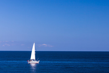 Obraz premium Isolated Yacht in the blue sea