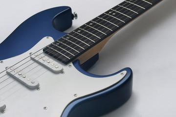 Closeup of a blue metallic electric guitar