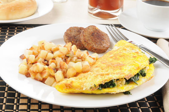 Breakfast omelet with sausage and hash browns