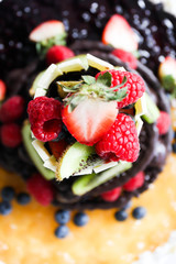 Chocolate cake, decorated with fresh fruits