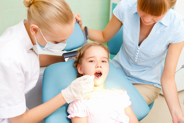 Little girl visiting dentist