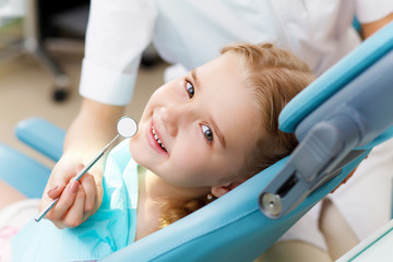 Little girl visiting dentist