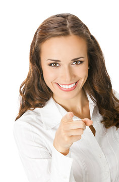 Businesswoman pointing finger at viewer, on white