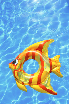 Fish shaped lifebuoy on swimming pool