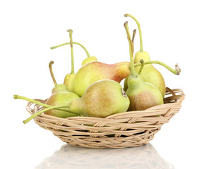 ripe pears in basket isolated on white.