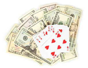 Dollars and a deck of playing cards isolated on white